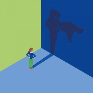 Bild: Frau steht vor Wand, ihr Schatten ist eine Superheldin