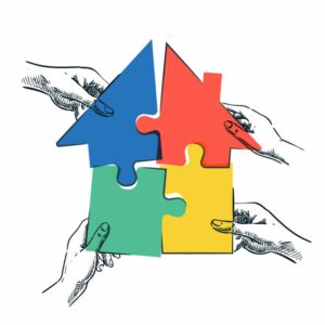 Bild: Hände halten mit Puzzleteilen ein Haus zusammen